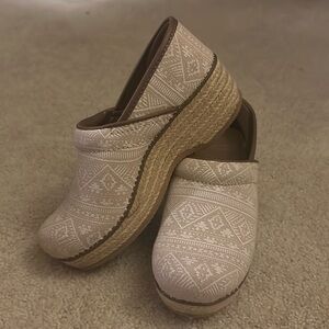 Dansko clogs, tan and white pattern